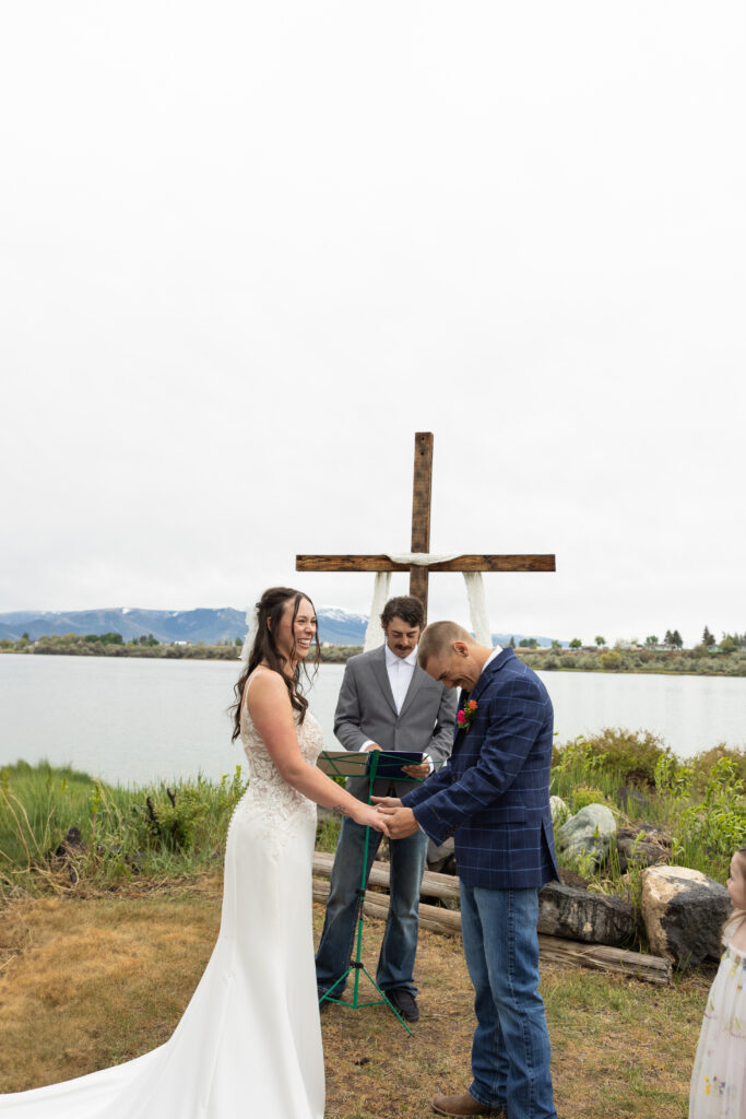 Candid couple photography - playful riverside session in Eagle